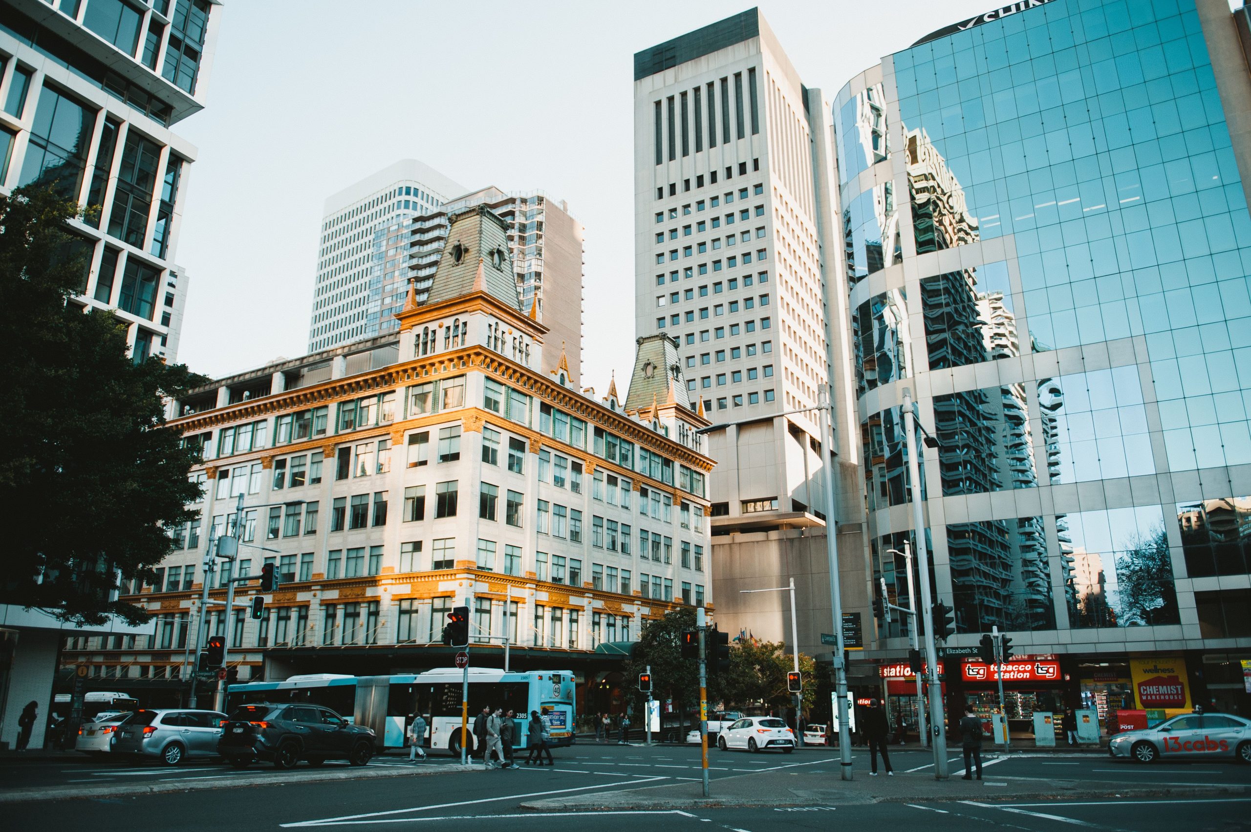 Dynamic cityscape showcasing modern architecture and street life in downtown Sydney, Australia.