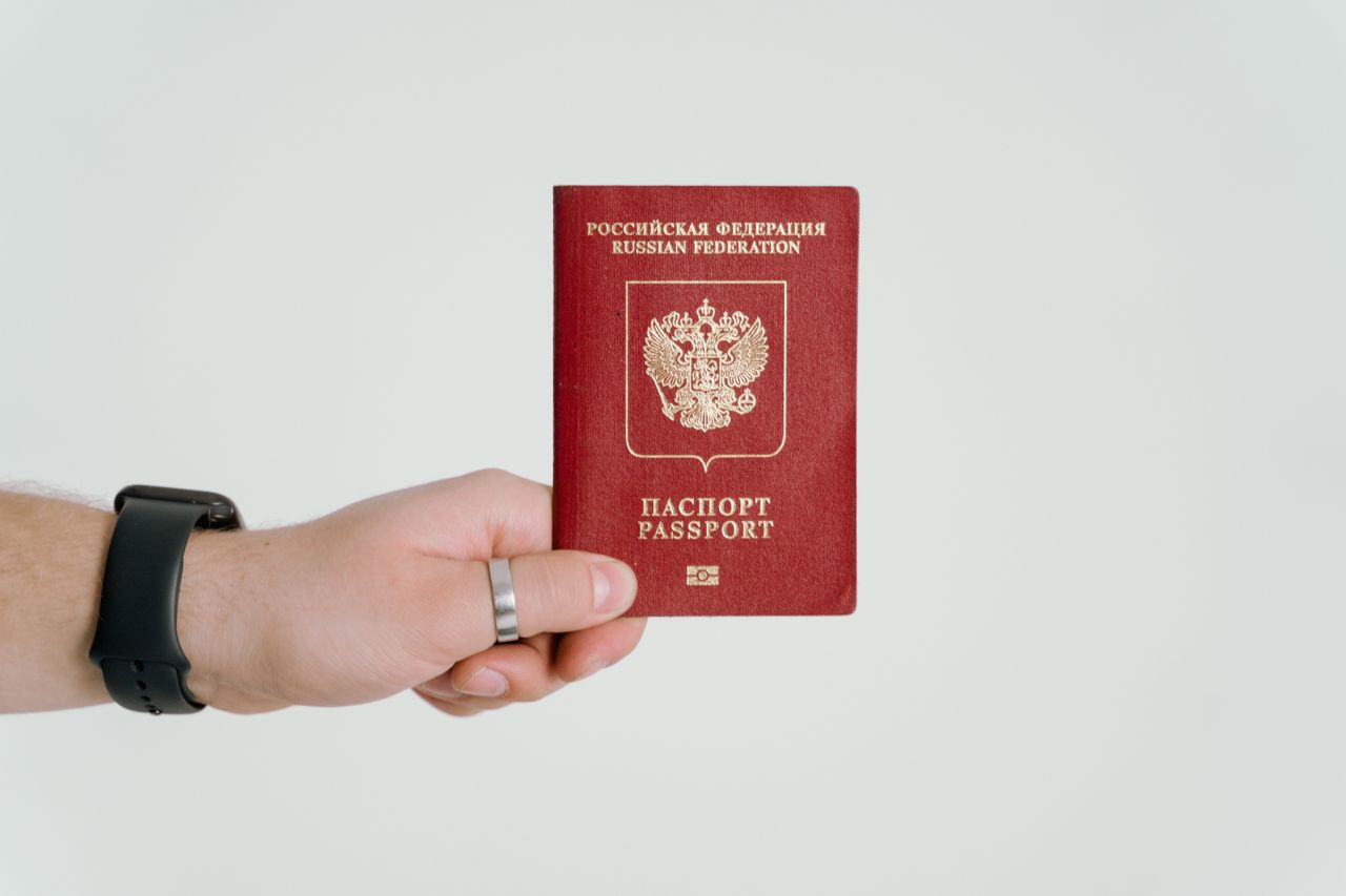 Crafting Captivating Headlines: Your awesome post title goes here Close-up of a hand holding a Russian Federation passport.